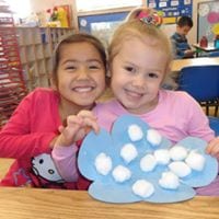 preschool girls with winter weather art